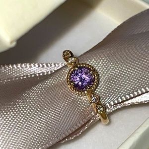 Purple sapphire and diamond ring in 14k yellow gold